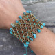 Ocean Breeze Cuff – Χειροποίητο βραχιόλι με χρυσή κλωστή και αυθεντικές τυρκουάζ πέτρες ειροποίητο βραχιόλι Ocean Breeze Cuff με μακραμέ και τυρκουάζ πέτρες